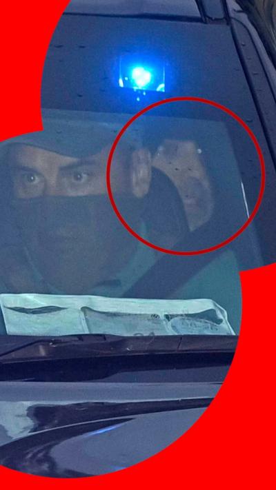 Daniel Kinahan, partially visible in the back of a police car, highlighted in a red circle.